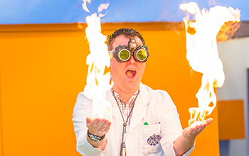 Mad scientist with fire in both hands